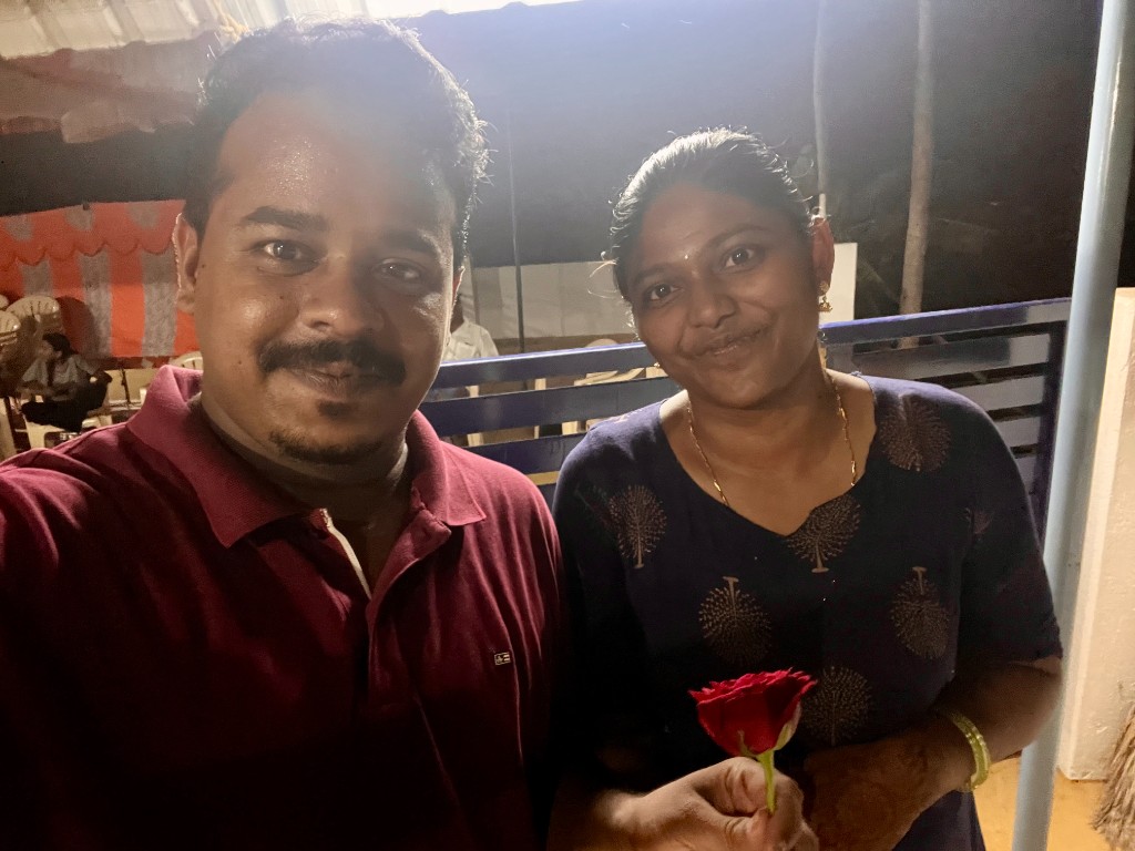 Vaishnavi and Sathriyan smiling together at an evening celebration
