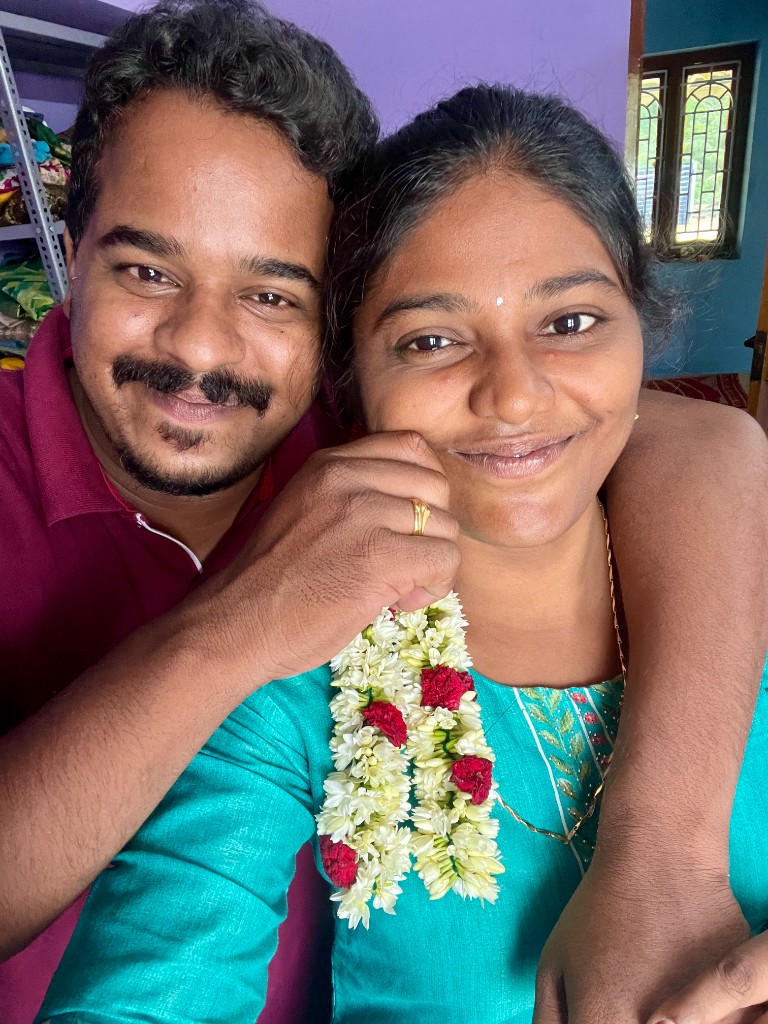 Vaishnavi and Sathriyan smiling together at an evening celebration
